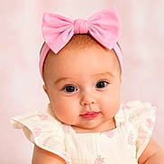 Mercy is registered to the contest to win money with this photo: baby, infant, child, pink_bow, headband, cute, portrait, closeup, dress, strawberry_pattern, soft_background, adorable, face, eyes, skin, cheeks, clothing, young, smiling, person