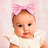 baby, infant, child, pink_bow, headband, cute, portrait, closeup, dress, strawberry_pattern, soft_background, adorable, face, eyes, skin, cheeks, clothing, young, smiling, person