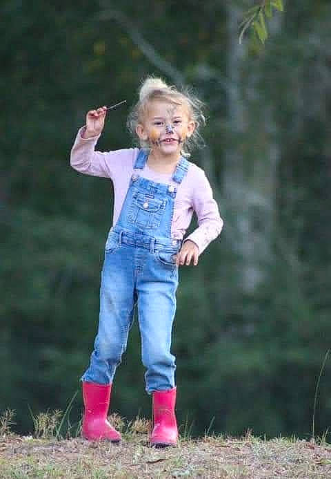 Elizabeth is registered to the contest to win money with this photo: blond, child, denim, electric_blue, flash_photography, forest, fun, gesture, grass, grassland, happy, jeans, joy, leg, leisure, people_in_nature, person, recreation, shoe, smile