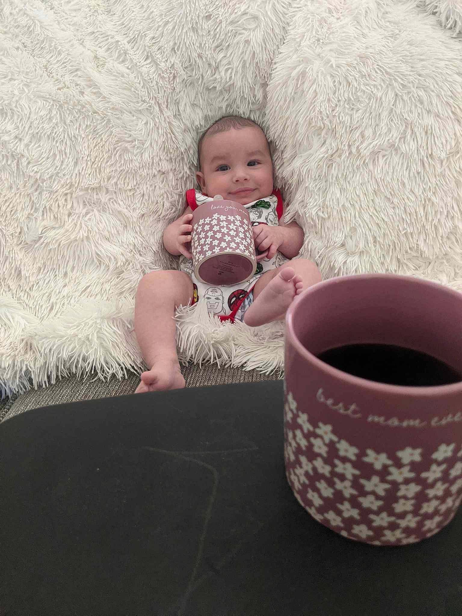 Joseph joined the competition — help win amazing prizes! baby, baby_toddler_clothing, coffee_cup, comfort, cup, dishware, drink, drinking, drinkware, joy, linens, mug, person, pink, porcelain, serveware, sitting, tableware, tea, teacup