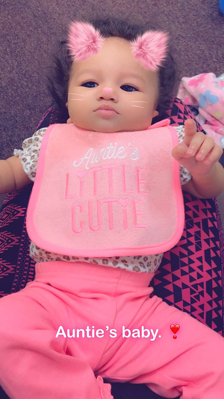 Zenleah is registered to the contest to win money with this photo: cheek, child, cool, day, face, forehead, girl, hair_accessory, head, human_hair_color, infant, lip, magenta, person, pink, product, skin, textile, toddler