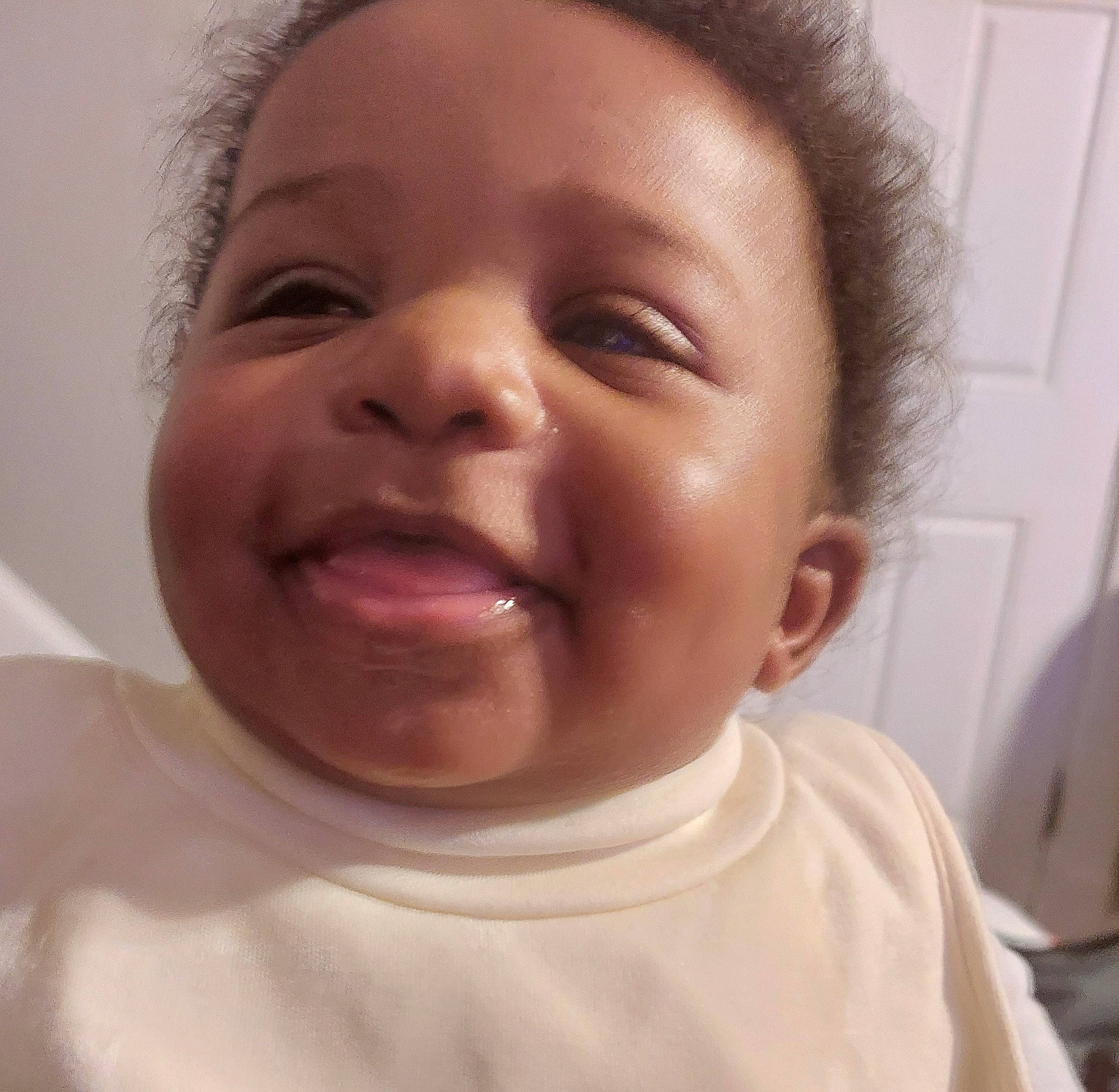 Daniel is registered to the contest to win money with this photo: baby_laughing, cheek, ear, eyebrow, eyelash, finger, forehead, gesture, happy, iris, jaw, lip, mouth, nose, person, skin, sleeve, smile, toddler, tongue