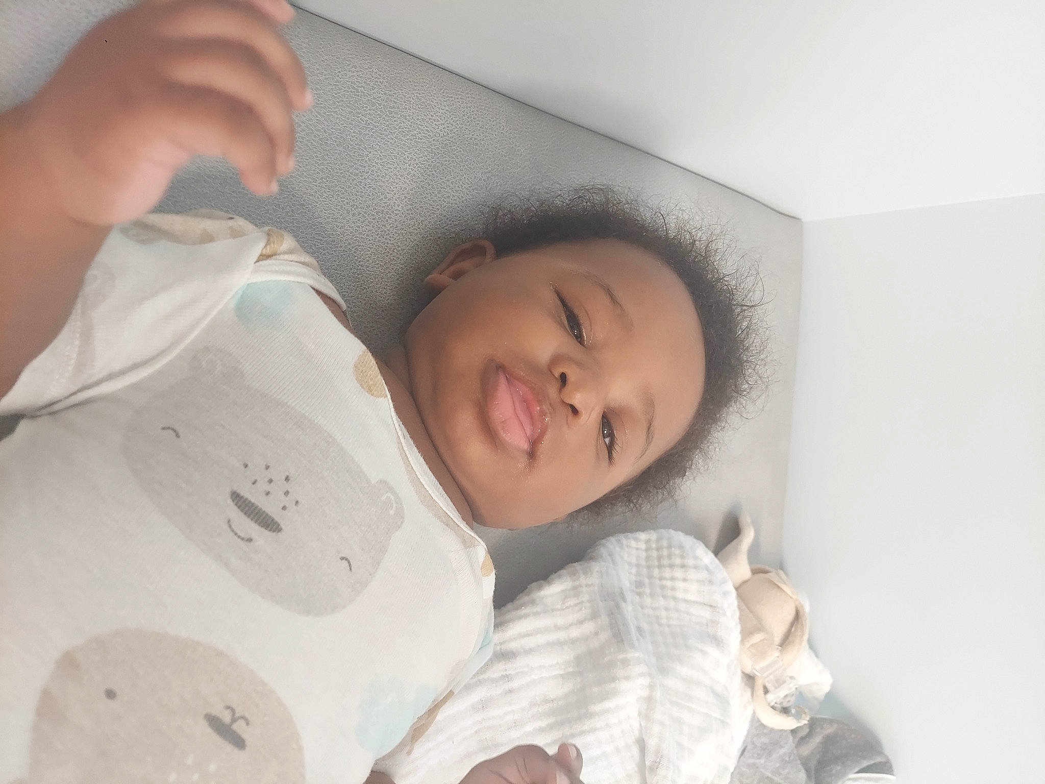 Daniel is registered to the contest to win money with this photo: arm, baby, baby_toddler_clothing, bed, bed_sheet, bedding, bedtime, child, comfort, eye, eyelash, hand, happy, illustration, linens, nap, person, room, skin, smile