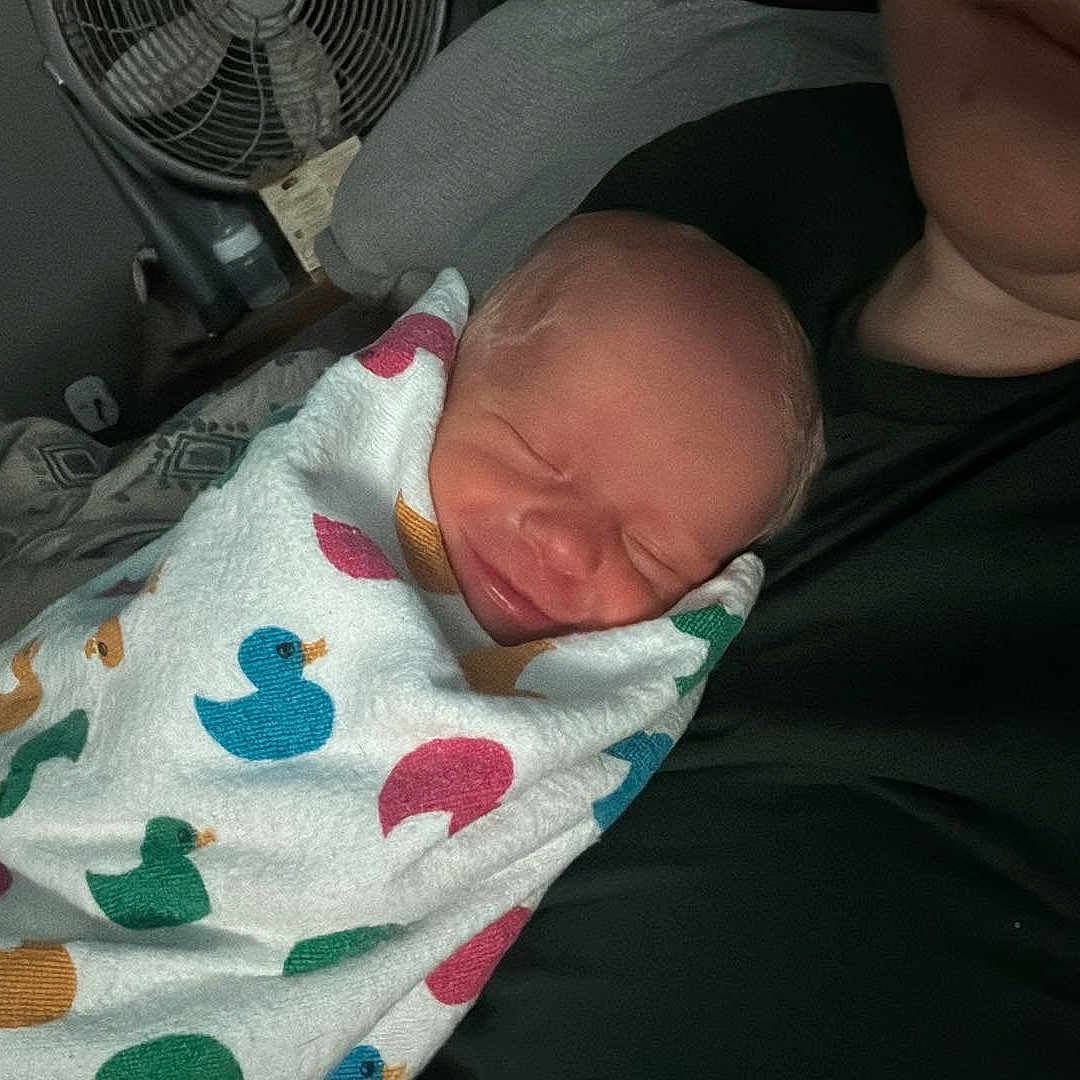 Serenity is registered to the contest to win money with this photo: architecture, baby, bed, blanket, building, clothing, cushion, face, furniture, glove, head, homedecor, hospital, newborn, person, photography, portrait, quilt, sleeping, t_shirt