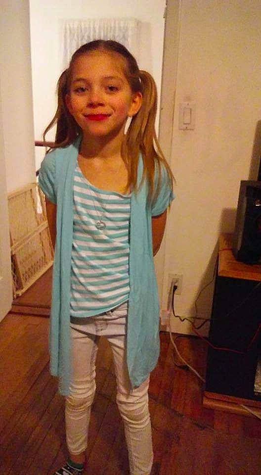 Ebony is registered to the contest to win money with this photo: child, child_model, clothing, jeans, joint, long_hair, neck, outerwear, person, shoulder, sleeve, sportswear, standing, t_shirt