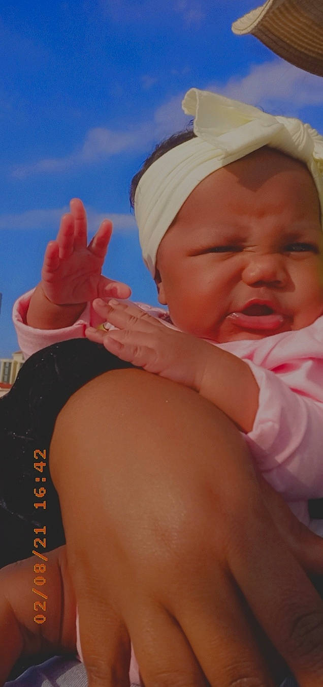 Graclynn joined the competition — help win amazing prizes! baby, baby_sleeping, cap, elbow, finger, fun, gesture, hand, happy, hat, headgear, human_body, nail, nose, person, pink, skin, sky, sorrow, thigh