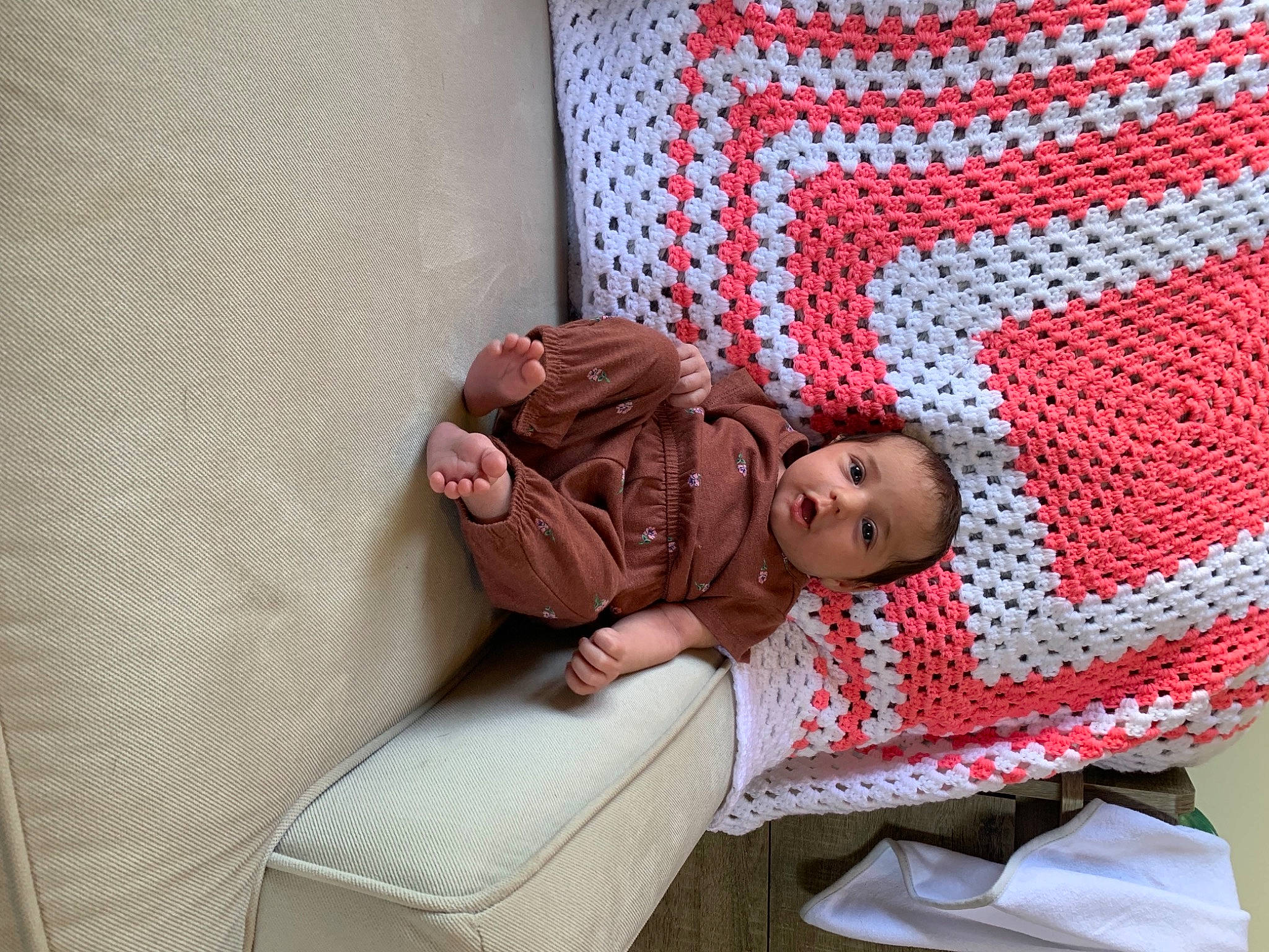 Sawyer is registered to the contest to win money with this photo: baby, baby_products, baby_safety, baby_toddler_clothing, bedding, carmine, child, comfort, couch, flooring, furniture, infant_bed, leisure, linens, pattern, person, room, sitting, textile, toddler