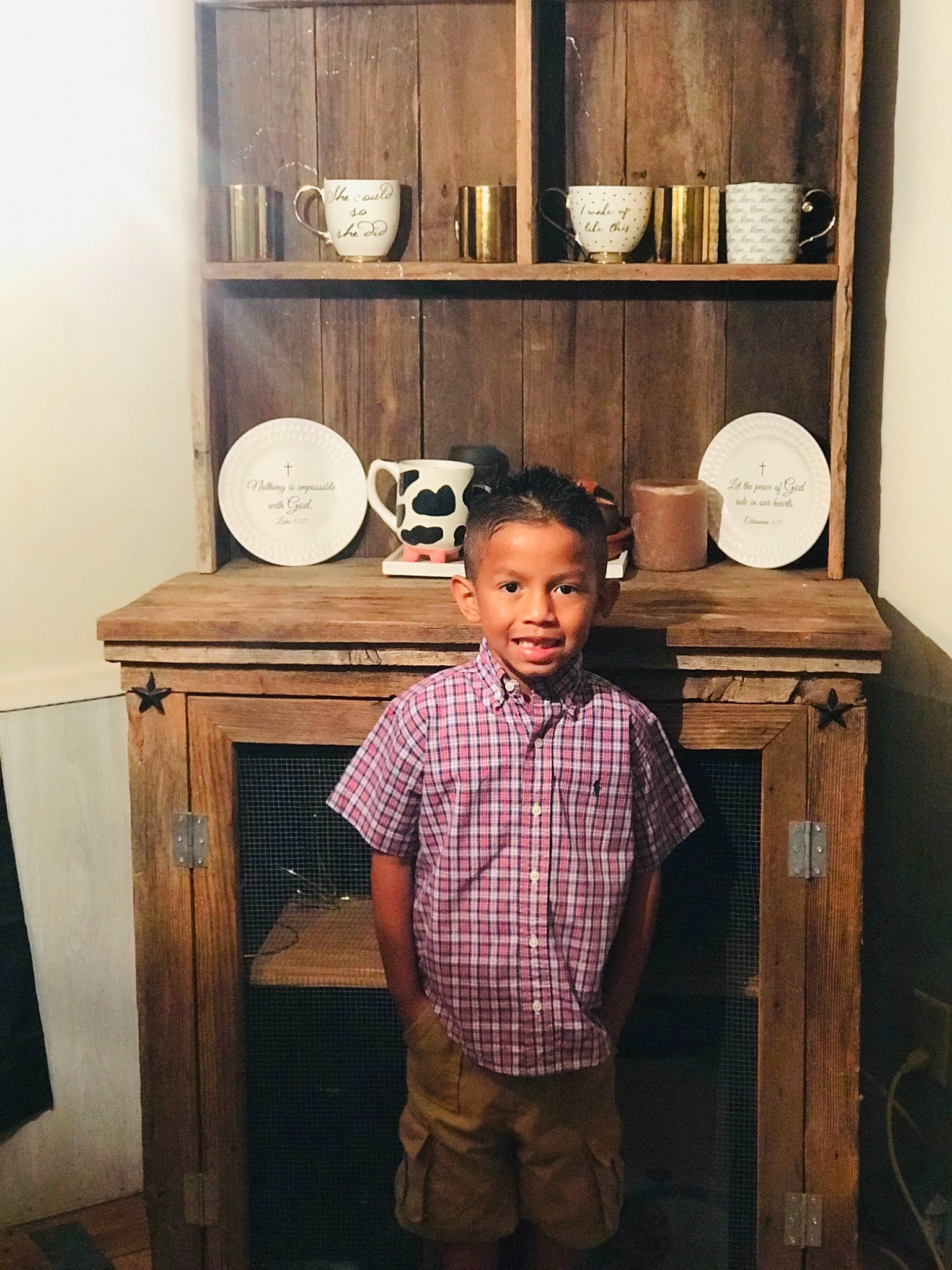 Jair is registered to the contest to win money with this photo: child, furniture, person, room, standing, wood