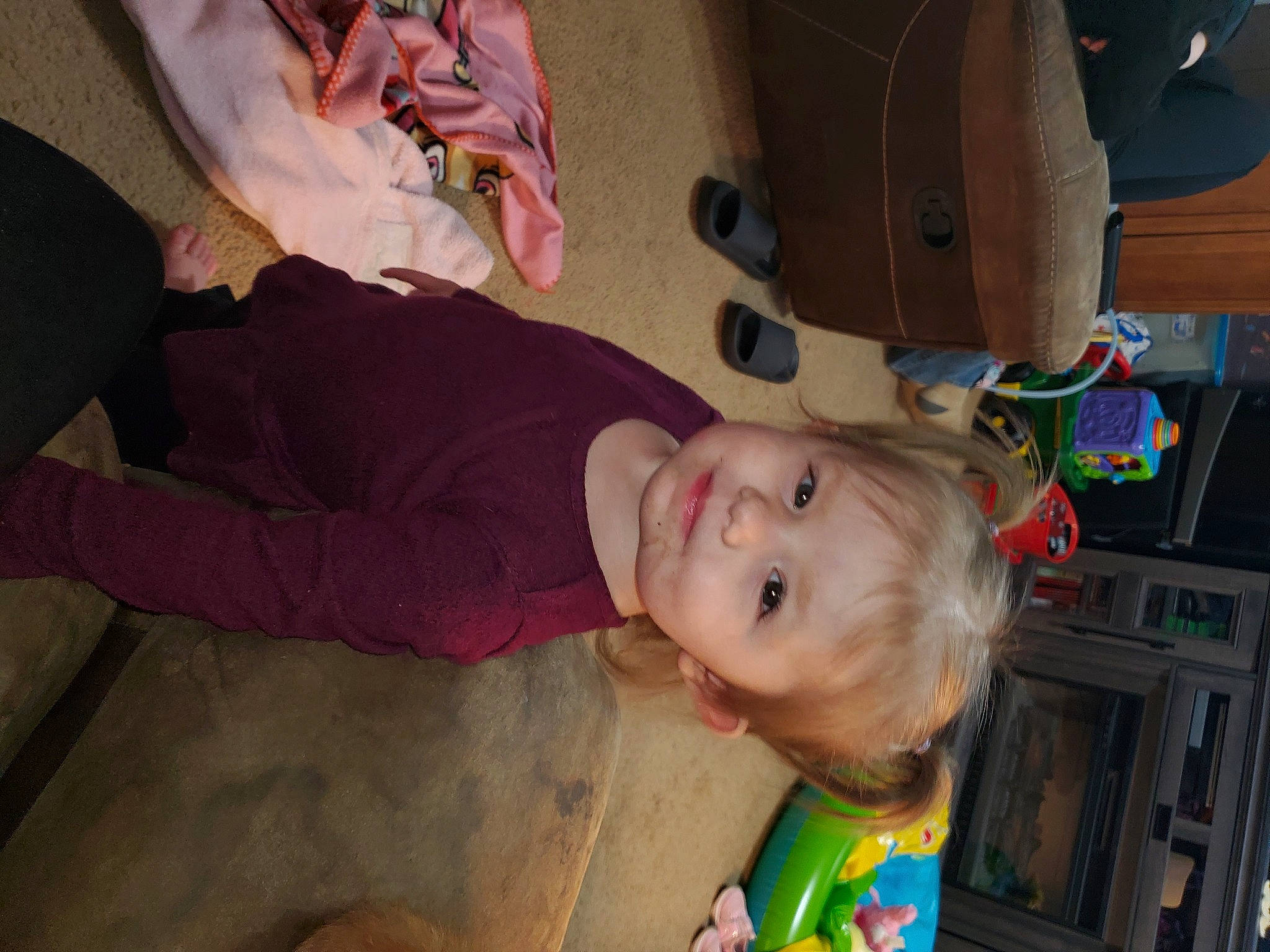 Michaela is registered to the contest to win money with this photo: baby, cheek, child, comfort, flooring, fun, happy, hardwood, joy, kitchen_appliance, mouth, nose, person, room, sitting, skin, smile, toddler, vacation, wood