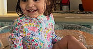 Sariyah joined the competition — help win amazing prizes! child, colorful_swimsuit, cute, furniture, happy, indoor, inflatable_float, leisure, plant, playful, pool, portrait, relaxing, sitting, smiling, toddler, vacation, water, wet_hair, young_child