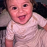 Ryan is registered to the contest to win money with this photo: baby, blanket, cartoon, casual, child, clothing, cute, expression, face, happy, home, indoors, joy, person, portrait, sitting, smiling, television, warm_lighting, young_child