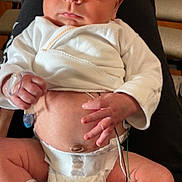 Daxtyn joined the competition — help win amazing prizes! baby, newborn, infant, diaper, medical_wires, hospital_band, white_clothing, person, legs, feet, hand, face, monitoring, healthcare, skin, cute, lying_down, indoors, closeup, expression