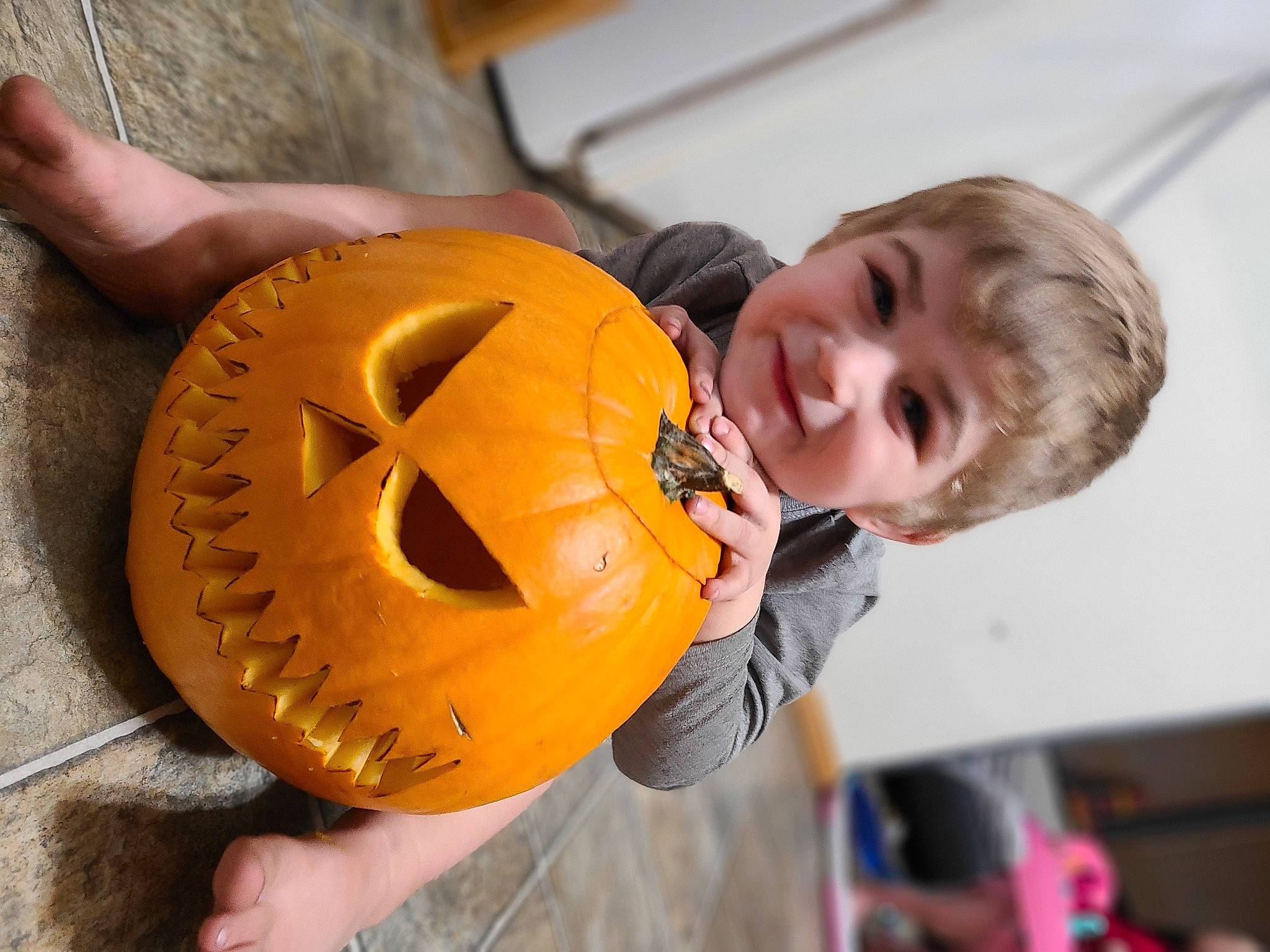 Alexander is registered to the contest to win money with this photo: calabaza, carving, child, cucurbita, jack_o_lantern, person, plant, pumpkin, toddler, vegetable, winter_squash