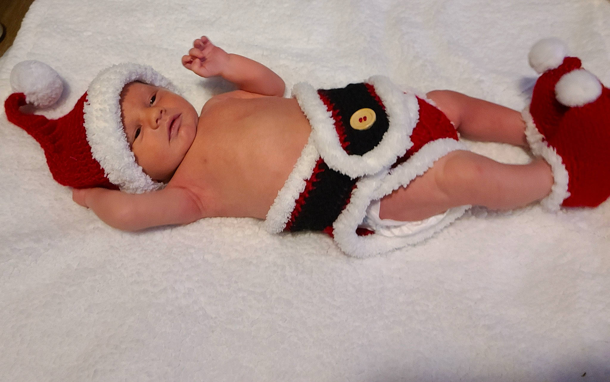 Keenan is registered to the contest to win money with this photo: abdomen, arm, baby, baby_sleeping, baby_toddler_clothing, comfort, eye, finger, fun, hand, head, headgear, headwear, human_body, leg, linens, person, skin, stomach, textile