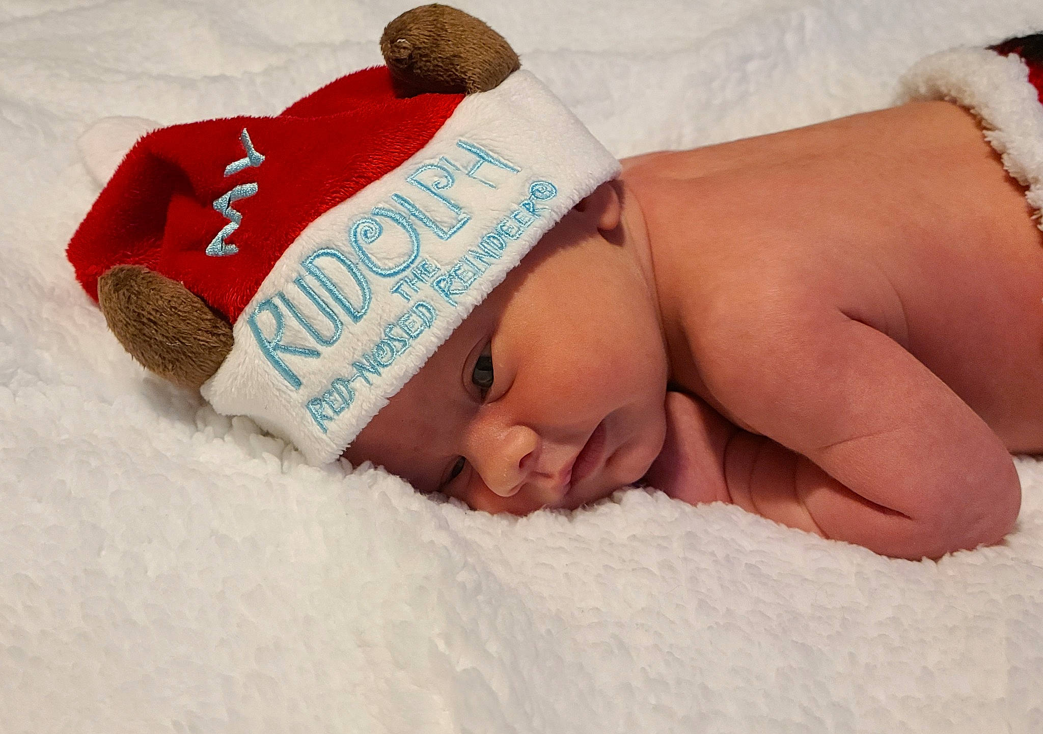 Keenan joined the competition — help win amazing prizes! arm, baby, baby_products, baby_sleeping, baby_toddler_clothing, bedding, cap, child, close_up, comfort, facial_expression, fashion_accessory, finger, happy, headgear, headwear, human_body, linens, mammal, person