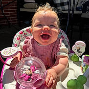 Wrenlee joined the competition — help win amazing prizes! baby, child, smiling, happy, toy, pink, activity_center, sunlight, outdoor, face, person, clothing, seat, play, infant, table, cushion, hand, cute, expression