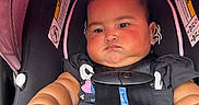 Willow joined the competition — help win amazing prizes! baby, car_seat, child, infant, pink_canopy, straps, outdoor, urban, sidewalk, black_clothing, pigtails, cute, chubby, serious_expression, flesh_tone, safety_harness, closeup, daylight, person, toddler