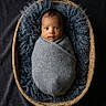 Yamir joined the competition — help win amazing prizes! baby, basket, blanket, blue_fabric, child, closeup, cozy, curly_fur, cute, face, head, indoor, infant, newborn, peaceful, portrait, soft_texture, studio, swaddled, wrapped