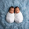 Yamir is registered to the contest to win money with this photo: baby, blanket, blue, child, closeup, cozy, cute, head, infant, lying_down, newborn, peaceful, portrait, resting, sleeping, soft, swaddled, twins, two, wrapped