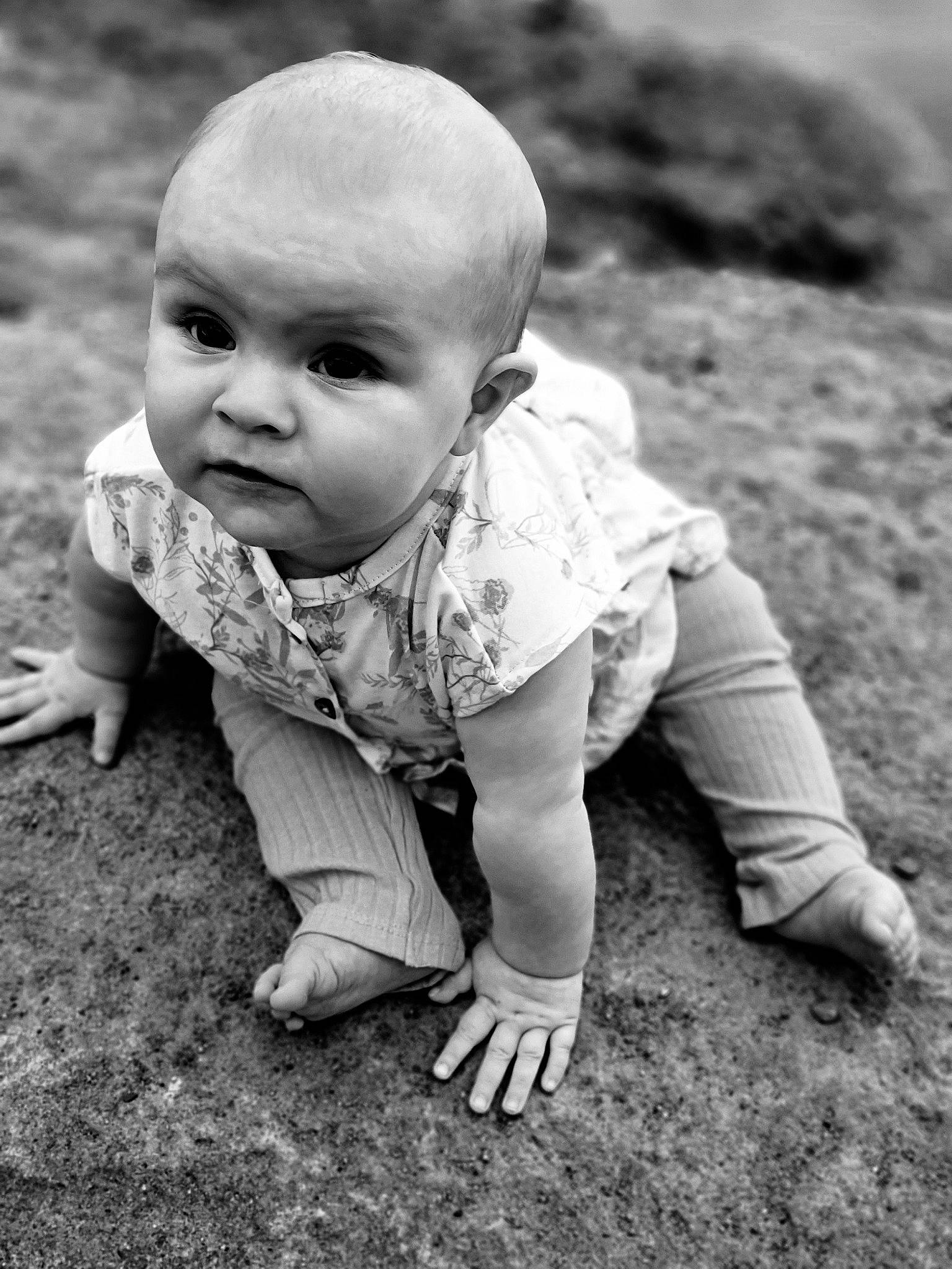 Estella joined the competition — help win amazing prizes! baby, baby_toddler_clothing, black, black_and_white, cheek, child, flash_photography, grass, grass_family, grey, happy, monochrome, monochrome_photography, people_in_nature, person, plant, sitting, standing, style, toddler