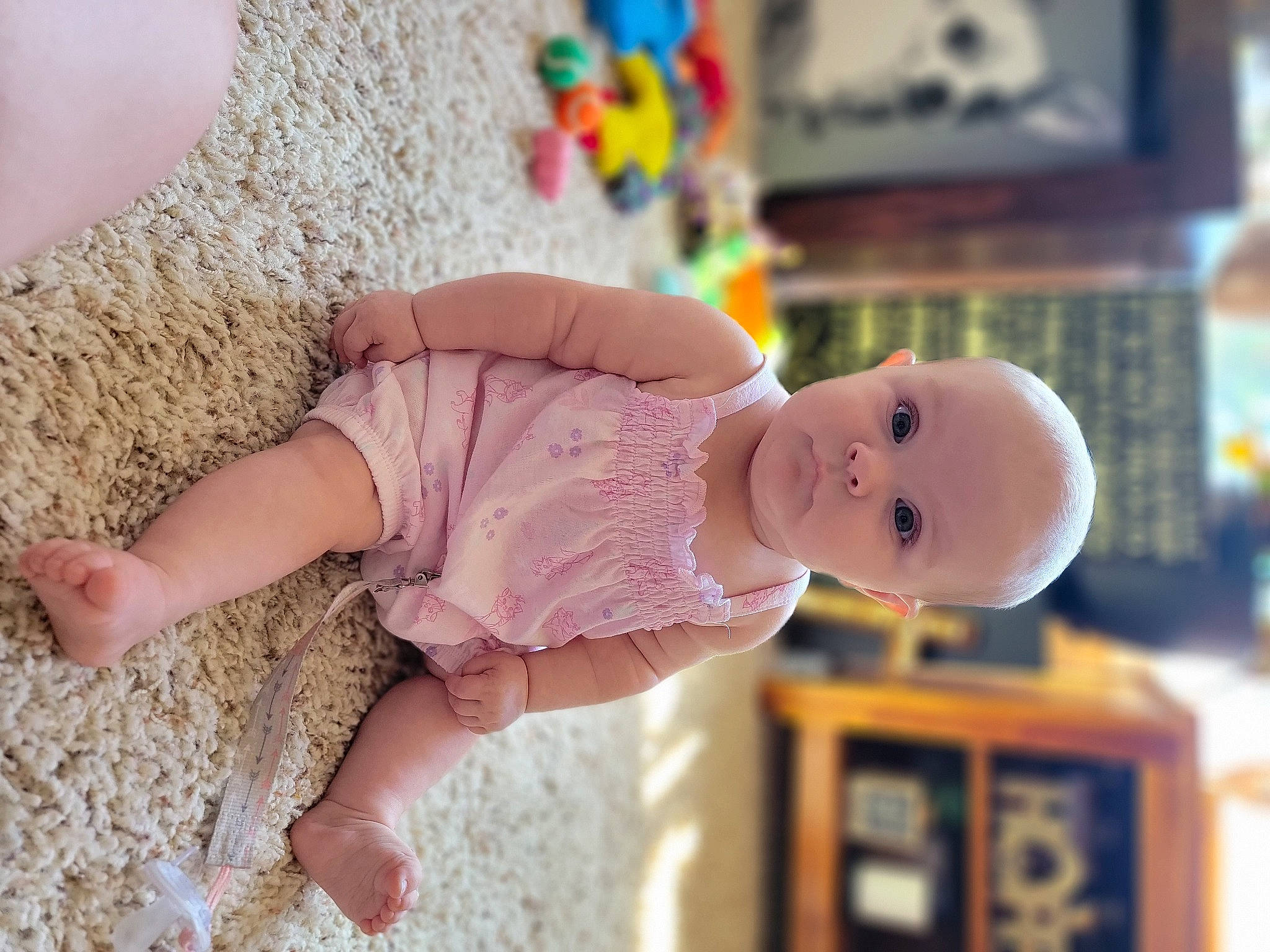 Estella joined the competition — help win amazing prizes! arm, baby, baby_toddler_clothing, child, clothing, dress, foot, fun, hand, happy, hat, human_leg, joint, leg, person, pink, shelf, skin, sleeve, toddler