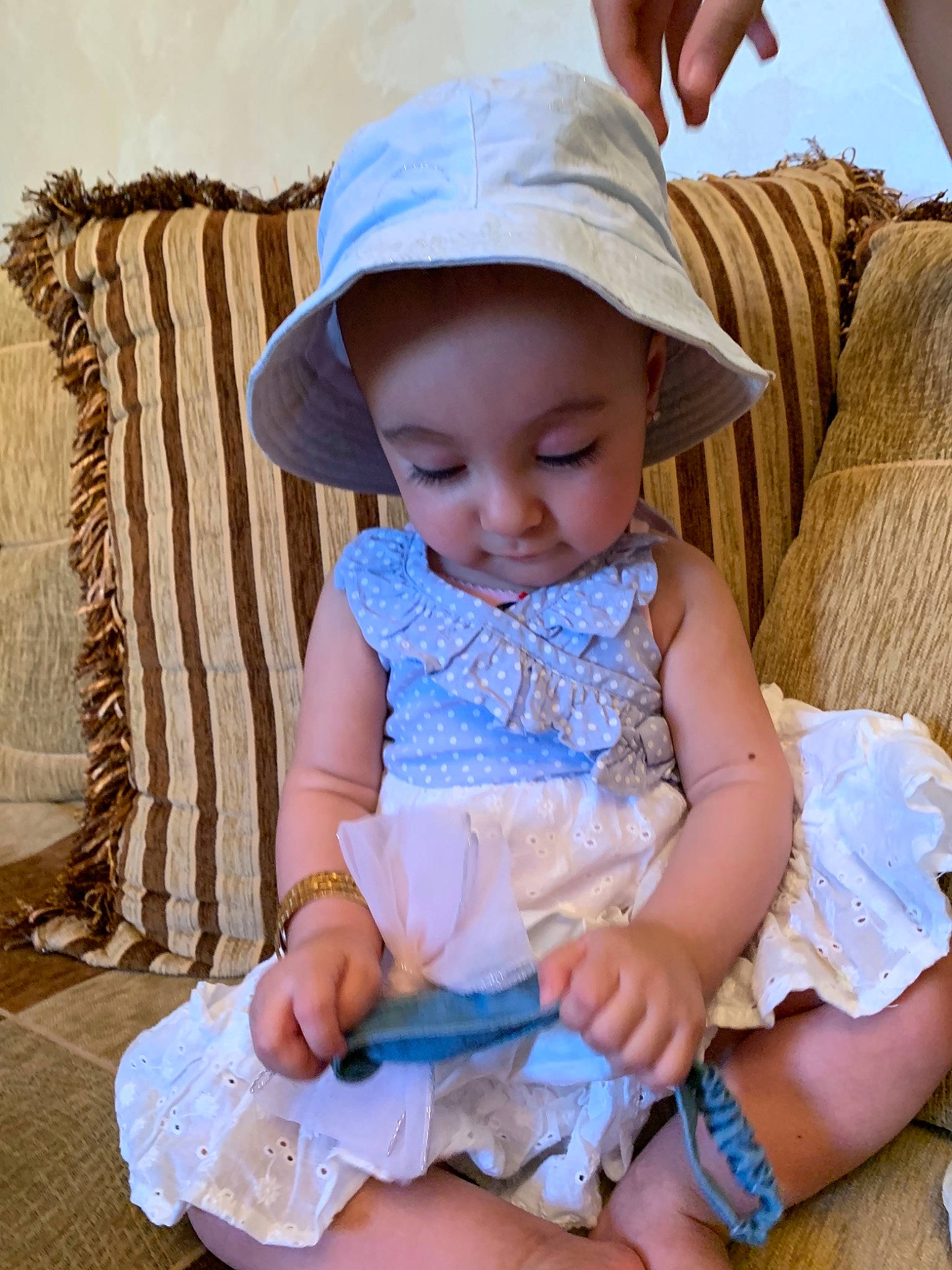 Lina is registered to the contest to win money with this photo: baby, baby_toddler_clothing, child, headgear, person, play, sitting, toddler