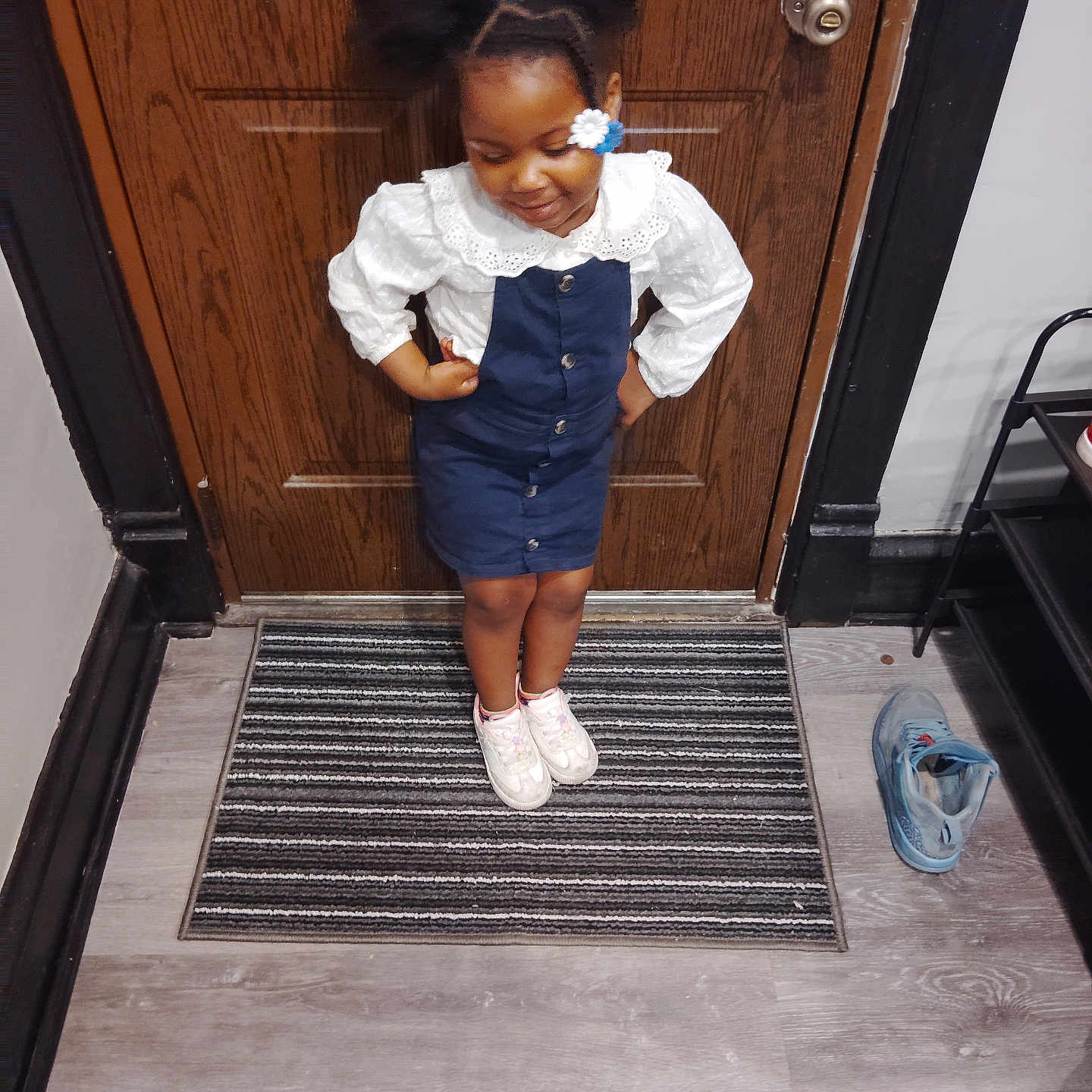 Rhythm joined the competition — help win amazing prizes! blue_dress, casual, child, cute, door, doormat, flooring, girl, hair_clip, home, indoor, portrait, puffy_hair, shoe_rack, single_shoe, smiling, sneakers, standing, white_shirt, wooden_door