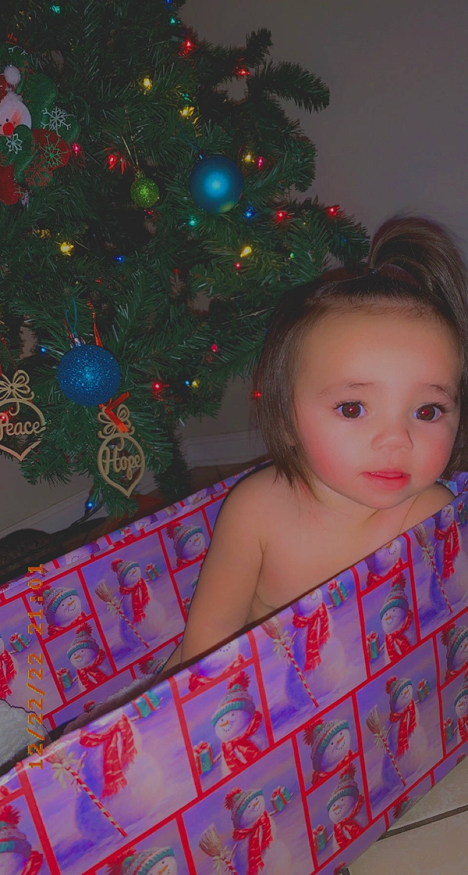 Maliyah is registered to the contest to win money with this photo: beauty, child, christmas, christmas_decoration, christmas_ornament, christmas_tree, conifer, event, evergreen, fun, happy, head, holiday, holiday_ornament, magenta, ornament, pattern, person, room, toddler