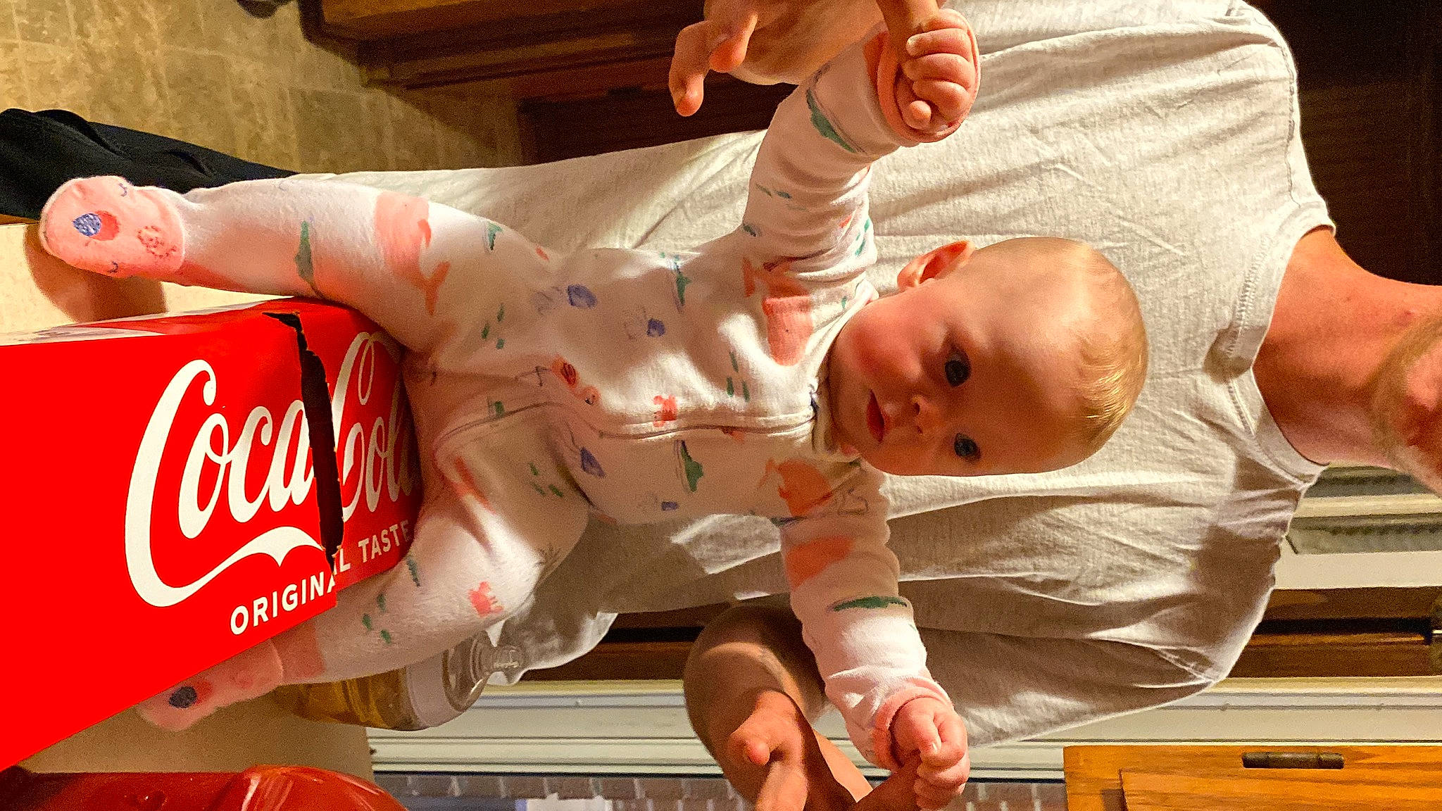 Braylen is registered to the contest to win money with this photo: aluminum_can, arm, baby, baby_toddler_clothing, carbonated_soft_drinks, carmine, chest, coca_cola, cola, comfort, drink, event, finger, hand, logo, muscle, person, plant, soft_drink, thumb