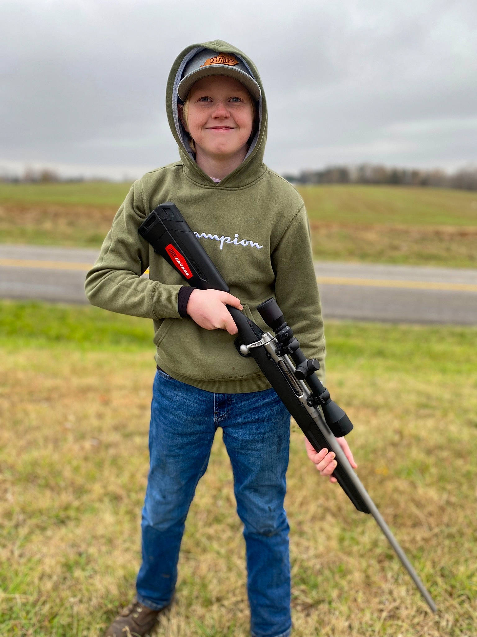 Devin joined the competition — help win amazing prizes! air_gun, cap, cloud, grass, grassland, headwear, joy, landscape, people_in_nature, person, personal_protective_equipment, plant, prairie, recreation, shotgun, sky, sleeve, smile, soil, sports_equipment