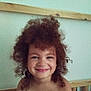 child, smiling, curly_hair, indoor, portrait, face, happy, toddler, bed, wood, skin, hair, person, cute, young, background, head, expression, joy, childhood