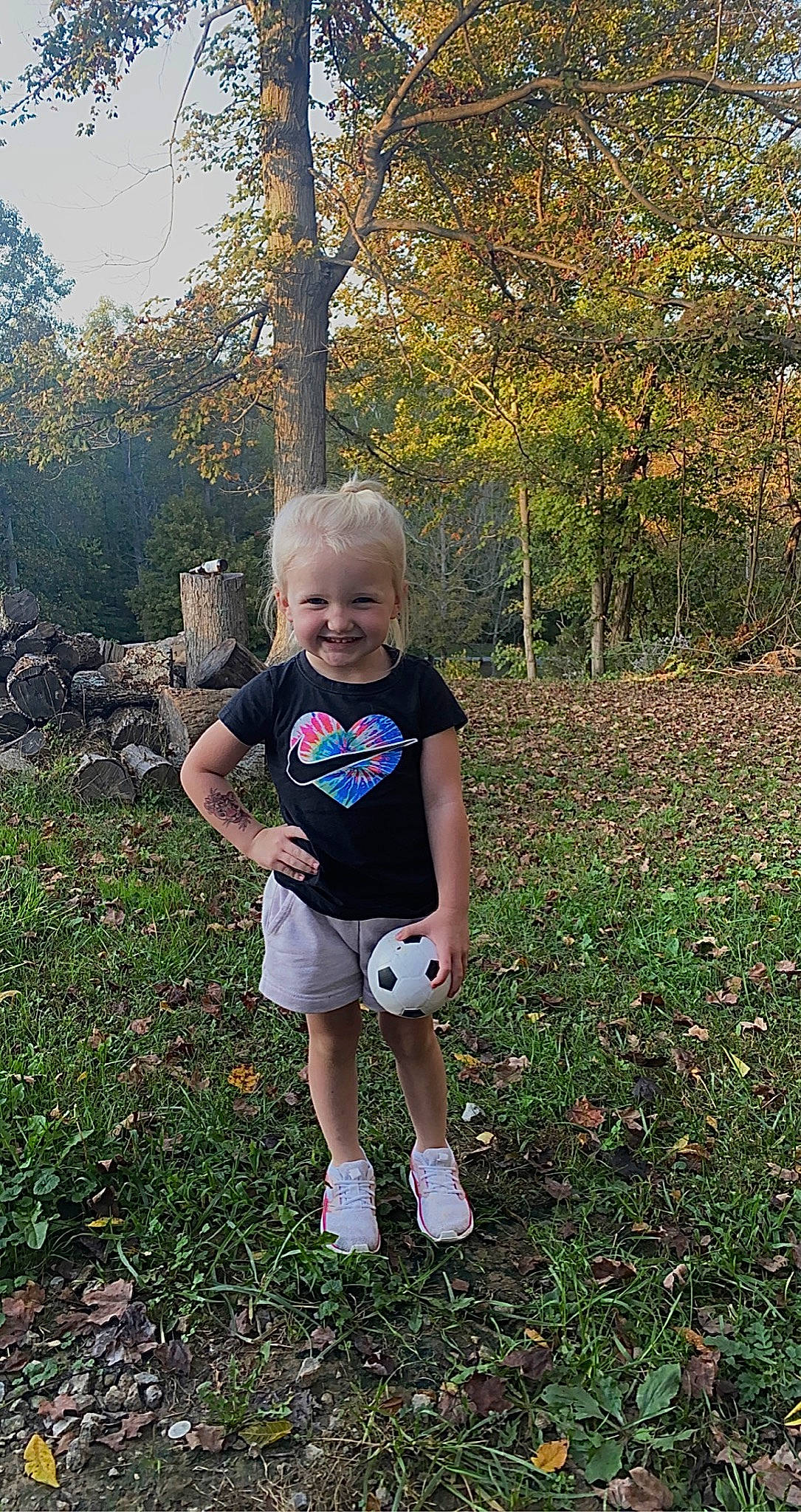Addyson joined the competition — help win amazing prizes! arm, baby_toddler_clothing, forest, fun, grass, grassland, happy, joy, leaf, leisure, people_in_nature, person, plant, recreation, sandal, shorts, sitting, sleeve, smile, t_shirt