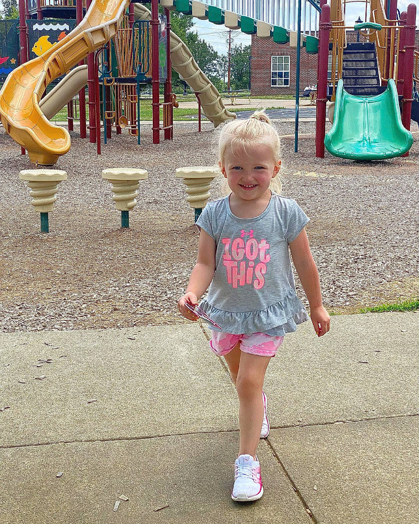 Addyson is registered to the contest to win money with this photo: child, chute, city, fun, grass, green, happy, joy, leisure, outdoor_recreation, person, photograph, playground, playground_slide, public_space, recreation, smile, snapshot, summer, toddler