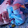 Aris joined the competition — help win amazing prizes! baby, infant, smile, blue_onesie, blanket, toy, lying_down, cute, child, face, hand, bed, sleepwear, patterned_blanket, comfort, indoors, soft_light, happy, young_child, resting