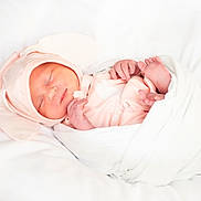 Daisy is registered to the contest to win money with this photo: newborn, baby, sleeping, swaddled, blanket, pink_clothing, hat, bunny_ears, infant, soft, cozy, peaceful, cute, portrait, resting, child, indoors, white_background, tiny_feet, hands