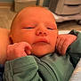 Leo is registered to the contest to win money with this photo: newborn, baby, infant, sleeping, green_clothing, hands, face, skin, blanket, indoor, cozy, resting, portrait, child, young, cuddly, soft, closeup, human, cute