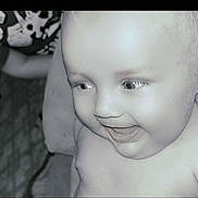Austin is registered to the contest to win money with this photo: baby, child, smiling, face, close_up, black_and_white, joyful, innocence, eyes, expression, portrait, happiness, infant, skin, person, young, head, cheeks, baby_toddler, cute