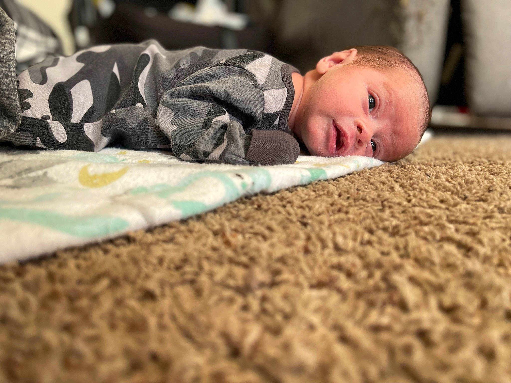 Zyaire is registered to the contest to win money with this photo: baby, baby_toddler_clothing, child, comfort, flash_photography, flooring, fun, grass, happy, head, linens, pattern, people_in_nature, person, portrait_photography, room, sitting, soil, toddler, tree