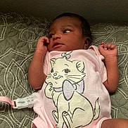 Dream joined the competition — help win amazing prizes! baby, infant, child, portrait, lying_down, bed, bedding, pink_onesie, cat_design, pacifier_clip, hands, arms, face, eyes, indoor, home, patterned_blanket, newborn, cute, casual_photo