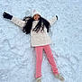 child, snow, winter, snow_angel, smile, hat, jacket, gloves, pants, shoes, outdoor, play, happy, cold_weather, snowy_ground, person, long_hair, fun, recreation, leisure