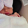 newborn, baby, sleeping, car_seat, blanket, hat, bow, infant, child, soft, cozy, resting, cute, pink, pastel, toddler, face, headwear, comfort, indoor
