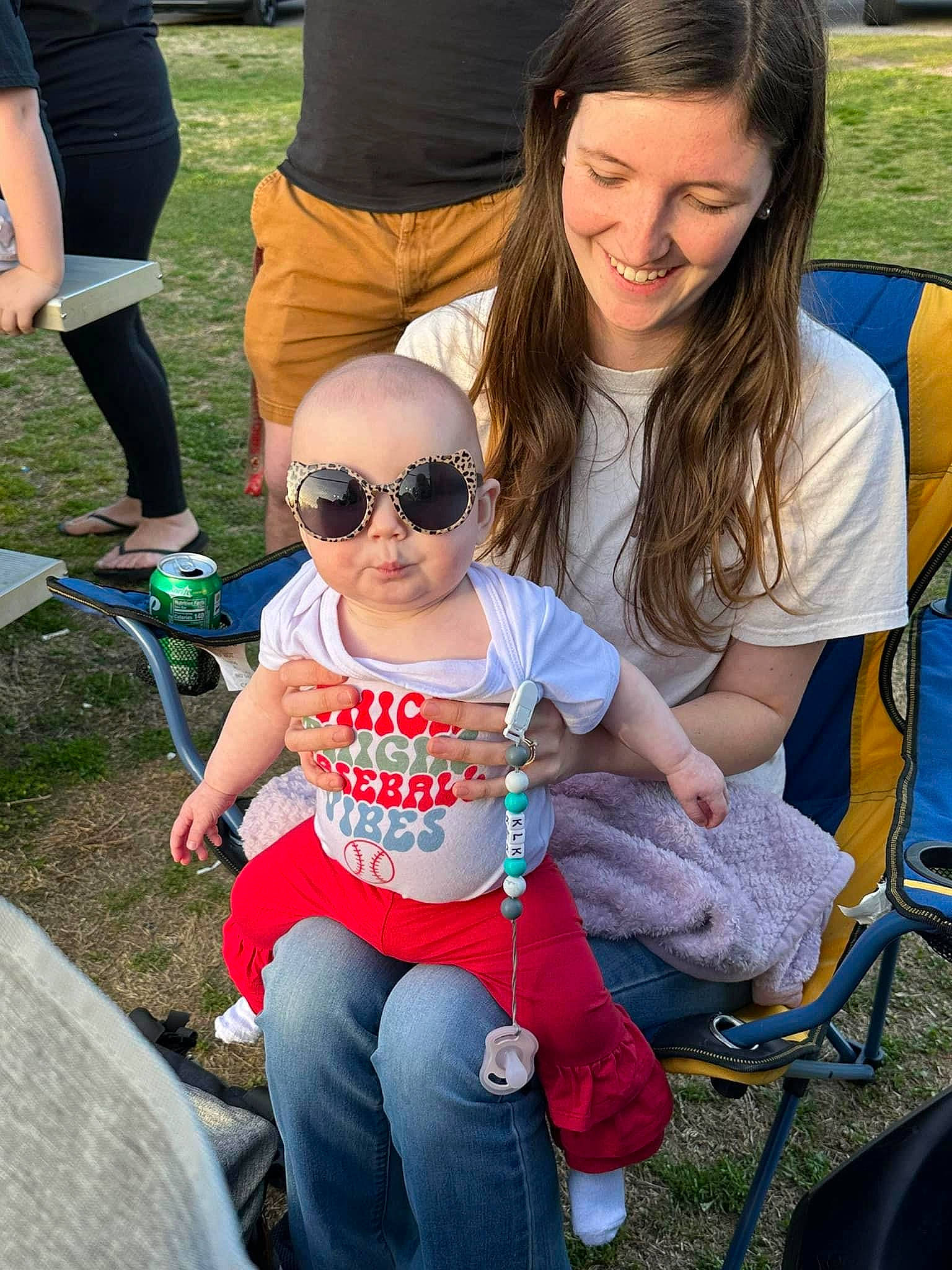 Kensleigh is registered to the contest to win money with this photo: clothing, eyewear, glasses, goggles, grass, hairstyle, happy, jeans, joy, lap, leg, leisure, person, plant, product, shoe, shorts, smile, style, sunglasses