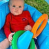 Colsen is registered to the contest to win money with this photo: baby, infant, child, red_shirt, blue_inflatable, green_ring, orange_ring, outdoor, grass, summer, toy, water_toy, seat, playtime, cute, portrait, person, skin, head, hands