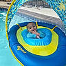 Milan is registered to the contest to win money with this photo: baby, blue, canopy, child, child_in_pool, float, floating, fun, happy, infant, inflatable, leisure, outdoor, play, pool, smile, summer, swimming_pool, water, yellow