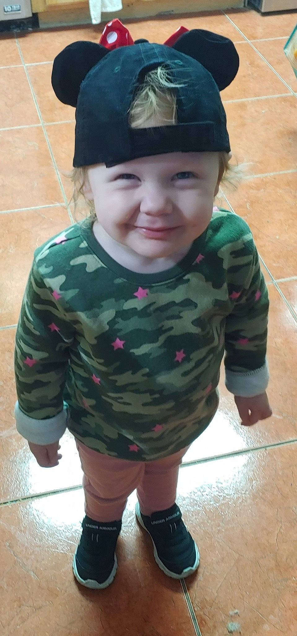 Yelena is registered to the contest to win money with this photo: academic_dress, baby_toddler_clothing, costume_accessory, floor, flooring, graduation, hair_accessory, headband, headgear, headwear, joy, long_sleeved_t_shirt, mortarboard, person, sleeve, tile, toddler