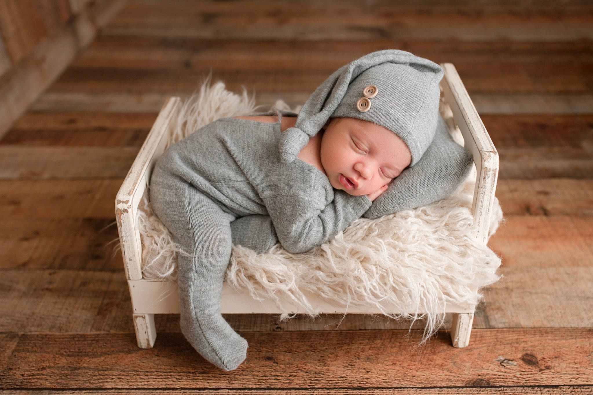 Jadiel joined the competition — help win amazing prizes! baby, baby_sleeping, beanie, beige, child, comfort, floor, flooring, headgear, headwear, outerwear, person, photography, product, sitting, toddler, wood, wood_flooring
