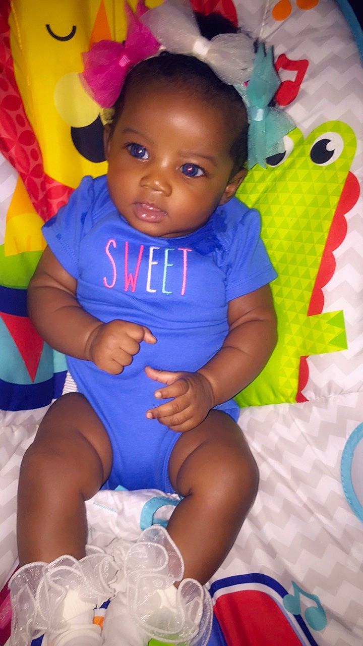 Maliah is registered to the contest to win money with this photo: baby, baby_products, baby_toddler_clothing, blue, cheek, child, person, pink, play, product, skin, smile, toddler