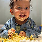 Ethan is registered to the contest to win money with this photo: birthday_cake, blue_sweater, cake, celebration, child, cream, crumbs, face, food, fun, hands, happy, indoor, messy, party, smile, space_theme, sprinkles, toddler, young_child