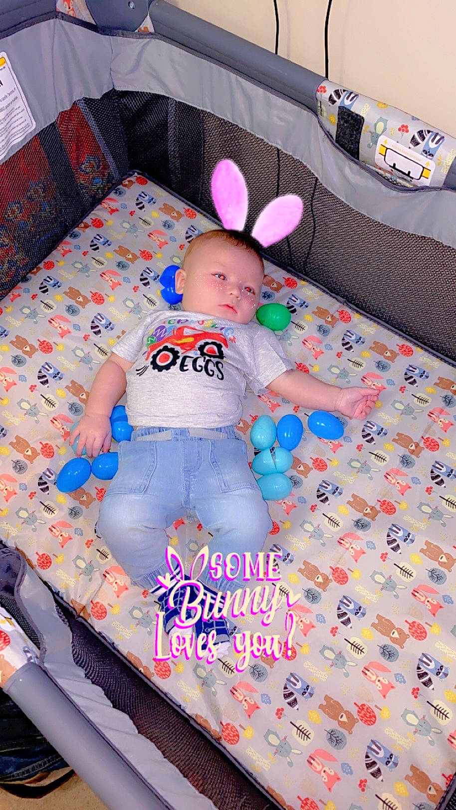 Colton is registered to the contest to win money with this photo: baby, baby_products, baby_toddler_clothing, baby_toys, bed, bed_sheet, bedding, child, comfort, infant_bed, linens, pattern, person, pink, play, plush, room, stuffed_toy, teddy_bear, textile