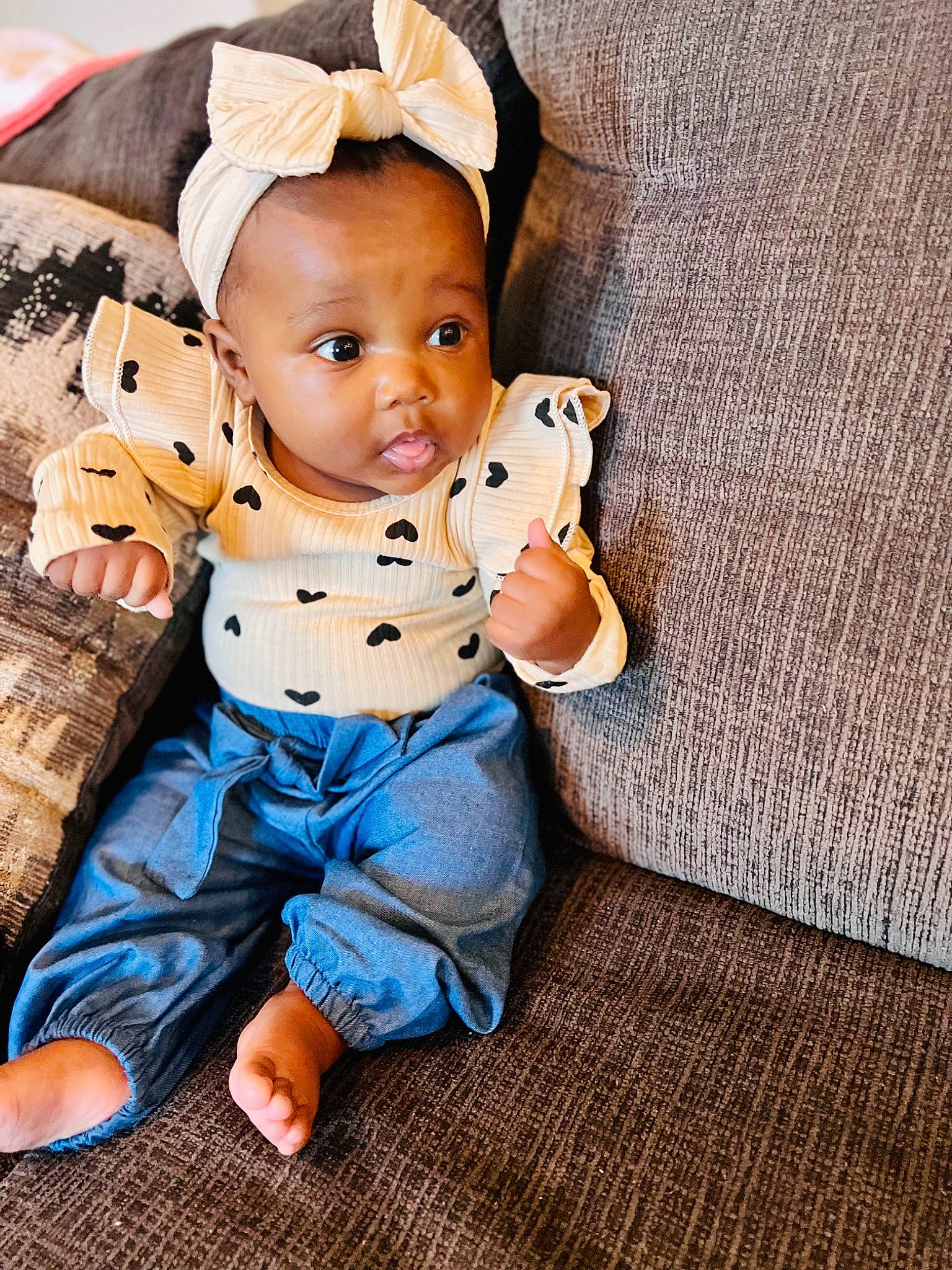 Anaya is registered to the contest to win money with this photo: baby, baby_toddler_clothing, barefoot, cap, cheek, child, costume_hat, eye, face, foot, happy, hat, person, sitting, skin, sleeve, stuffed_toy, sun_hat, toddler, toy